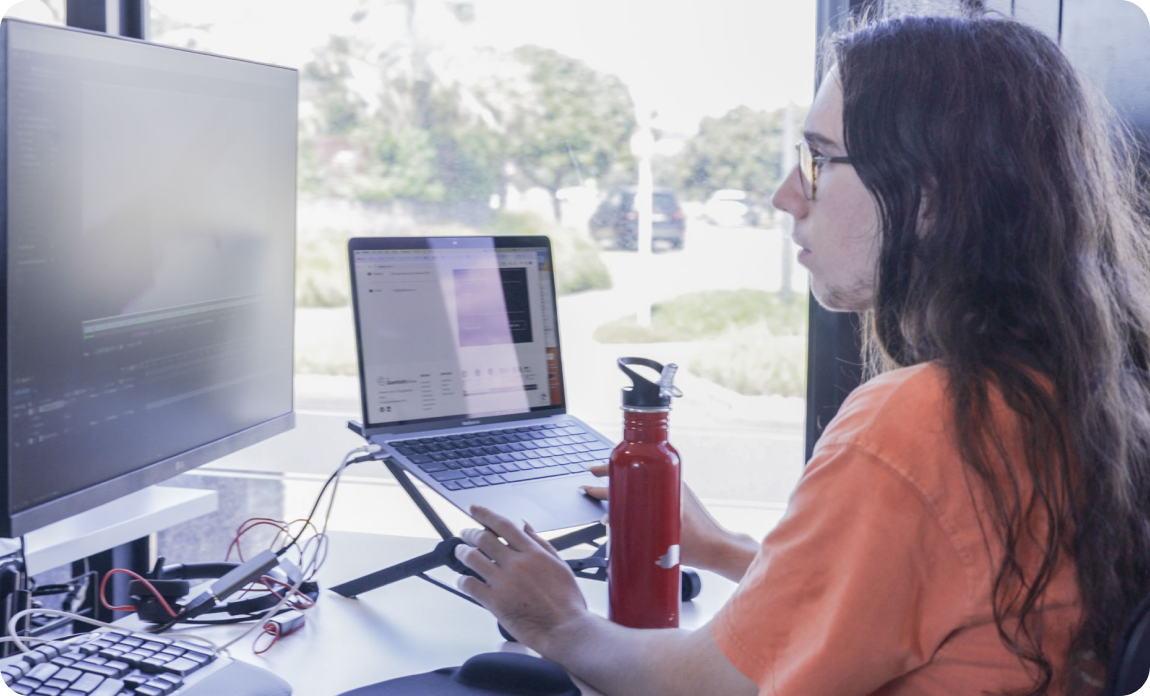 Q Award intern works on a computer.