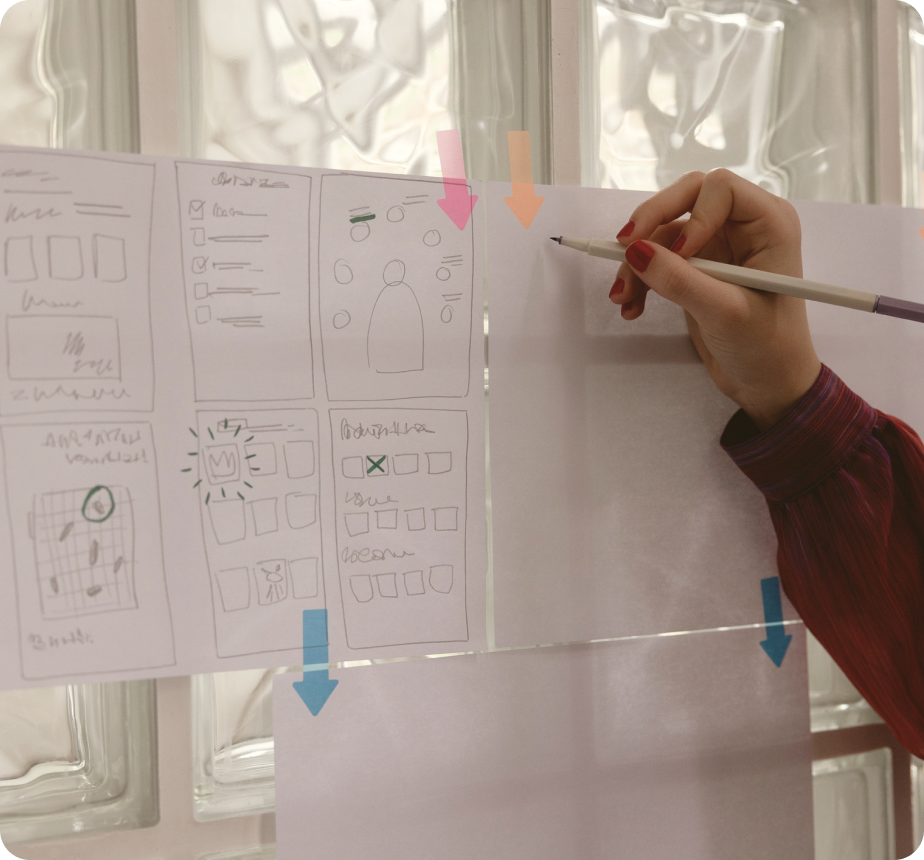 A hand draws the concept of a customer journey map.