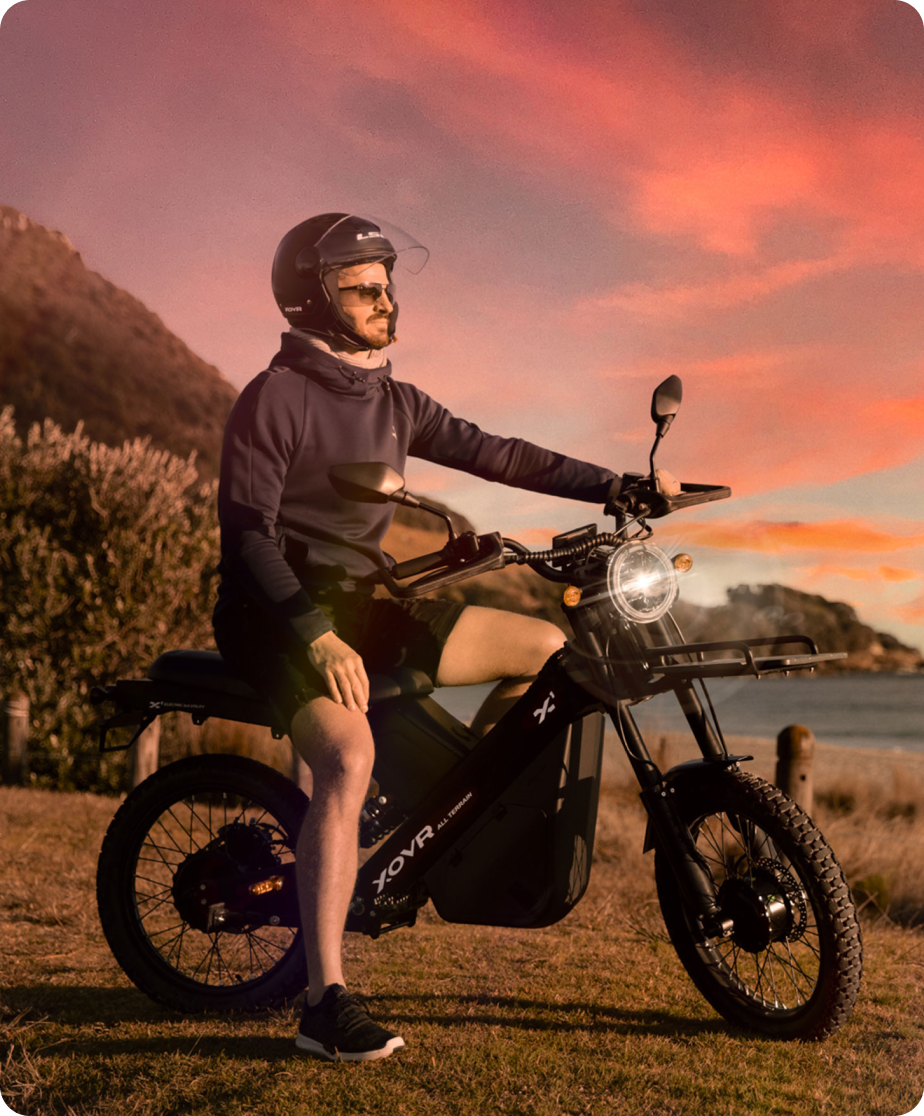 A man sits on an XOVR ebike.