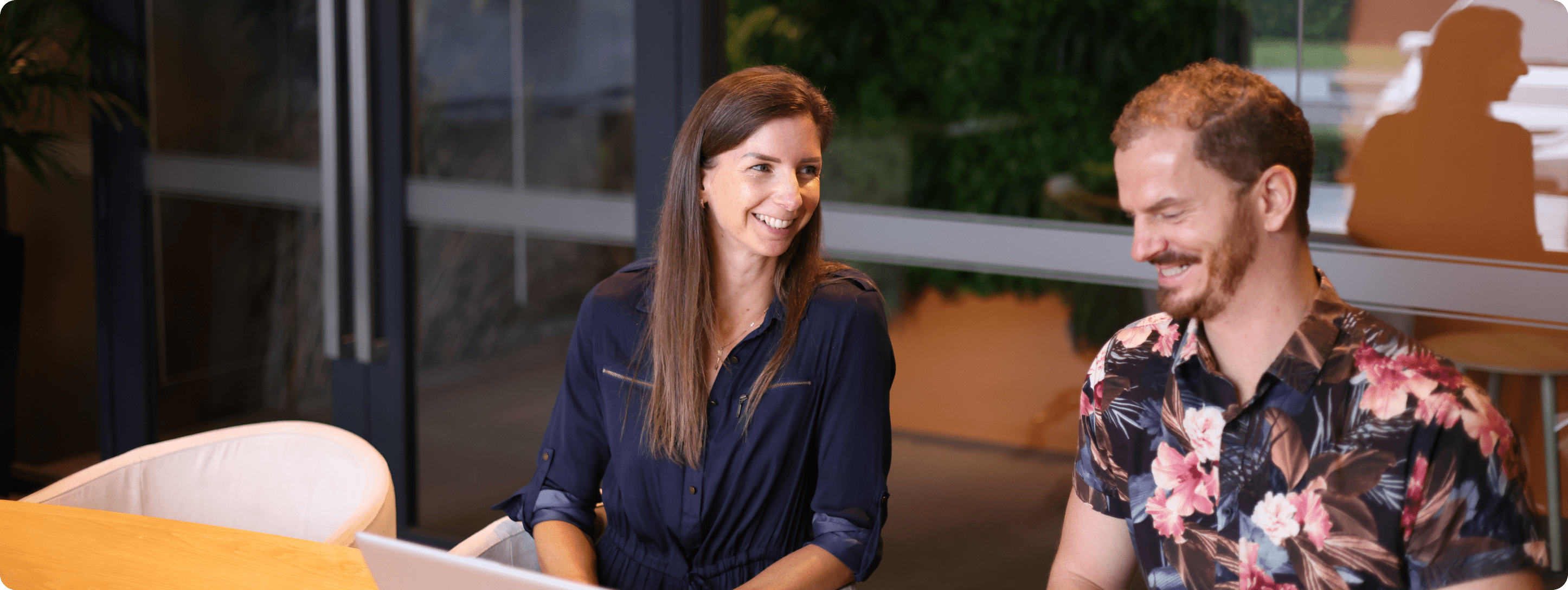 Two consultants from The Quentosity Group discuss a client's website.